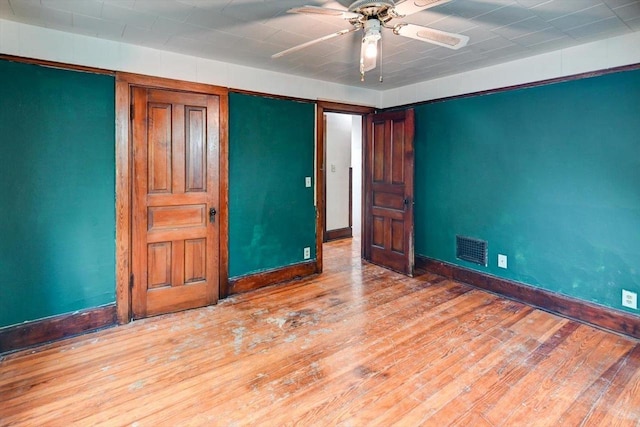 1235 Chandler St, Madison, WI 53715 - unfurnished bedroom featuring baseboards, wood finished floors, and ceiling fan