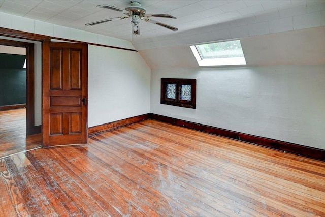 1235 Chandler St, Madison, WI 53715 - additional living space featuring a skylight, hardwood / wood-style flooring, baseboards, vaulted ceiling, and a ceiling fan
