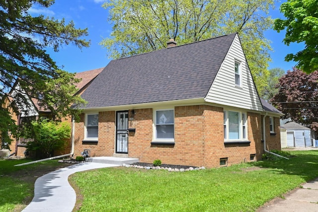 5002 N 24th Pl, Milwaukee, WI 53209 - view of front of property featuring brick siding, a chimney, a front yard, and roof with shingles
