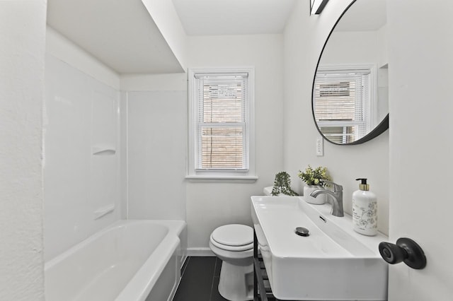 5002 N 24th Pl, Milwaukee, WI 53209 - full bathroom with toilet, a sink, tile patterned floors, baseboards, and bathing tub / shower combination