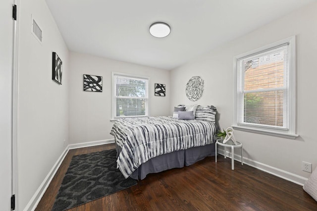 5002 N 24th Pl, Milwaukee, WI 53209 - bedroom featuring dark wood-type flooring and baseboards