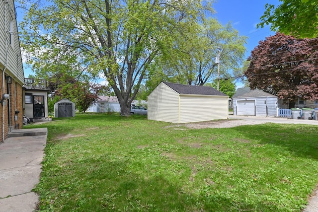 5002 N 24th Pl, Milwaukee, WI 53209 - view of grassy yard with a garage