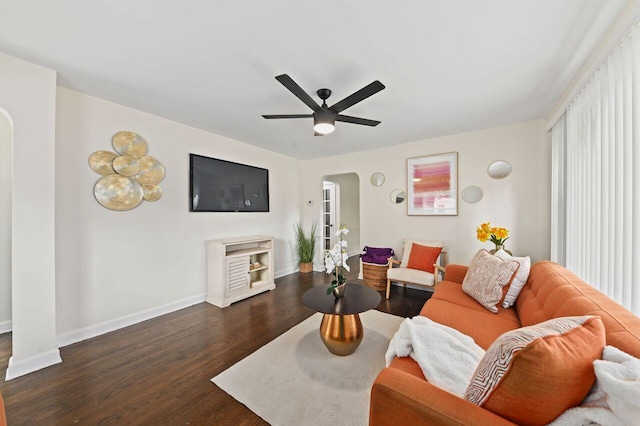 5002 N 24th Pl, Milwaukee, WI 53209 - living area featuring arched walkways, wood finished floors, baseboards, and a ceiling fan