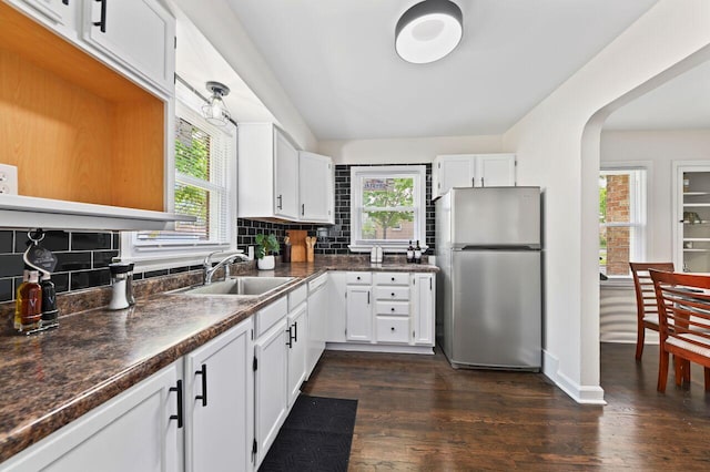 5002 N 24th Pl, Milwaukee, WI 53209 - kitchen featuring freestanding refrigerator, healthy amount of natural light, a sink, and dark countertops