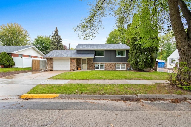 1254 Thorndale St, Green Bay, WI 54304 - split level home featuring an attached garage and concrete driveway