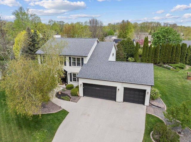1620 Fieldstone Ln, Howards Grove, WI 53083 - view of front of property featuring a front yard, concrete driveway, a shingled roof, a chimney, and an attached garage