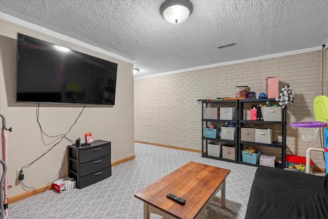 1620 Fieldstone Ln, Howards Grove, WI 53083 - carpeted living room with brick wall, baseboards, crown molding, and a textured ceiling