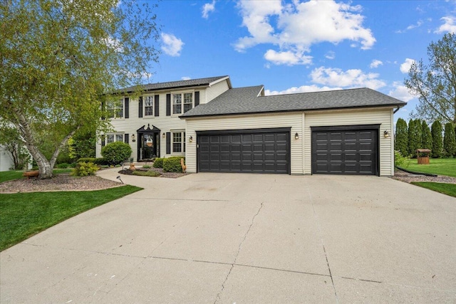 1620 Fieldstone Ln, Howards Grove, WI 53083 - colonial inspired home featuring a garage and driveway