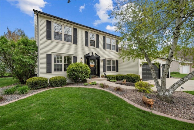 1620 Fieldstone Ln, Howards Grove, WI 53083 - colonial inspired home featuring a garage, a front yard, and concrete driveway