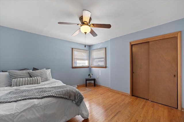 4683 N 80th St, Milwaukee, WI 53218 - bedroom with light wood-style flooring, baseboards, a ceiling fan, and a closet