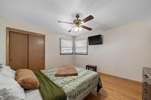 4683 N 80th St, Milwaukee, WI 53218 - bedroom featuring a closet, light wood-style floors, baseboards, and a ceiling fan