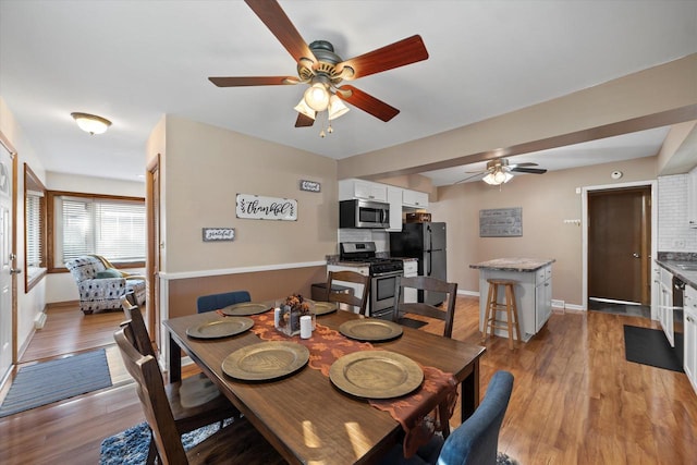 4683 N 80th St, Milwaukee, WI 53218 - dining room featuring ceiling fan, baseboards, and light wood finished floors