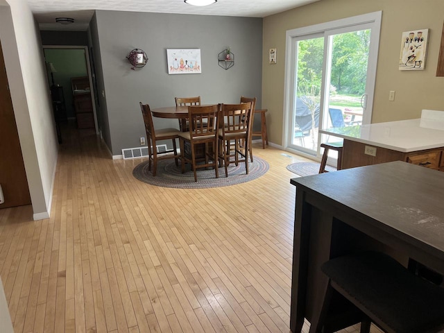 S9085 Meadowdale Rd, Prairie Du Sac, WI 53578 - dining area featuring light wood finished floors and baseboards