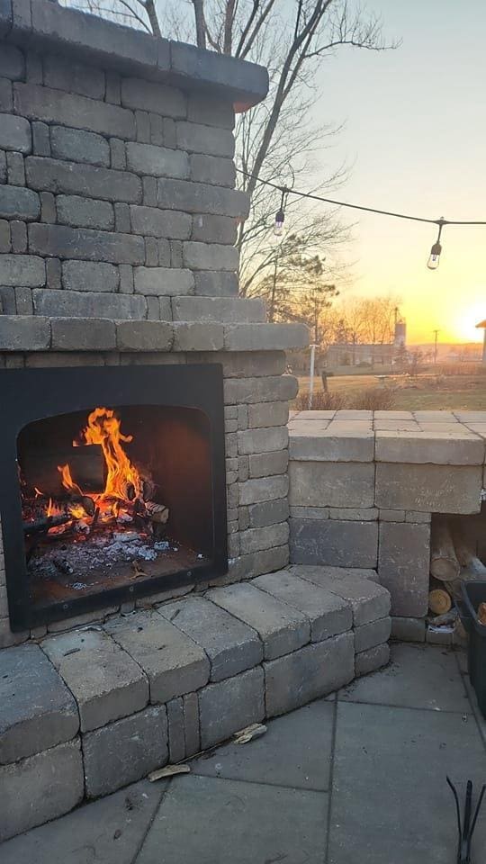 S9085 Meadowdale Rd, Prairie Du Sac, WI 53578 - detailed view of a lit fireplace