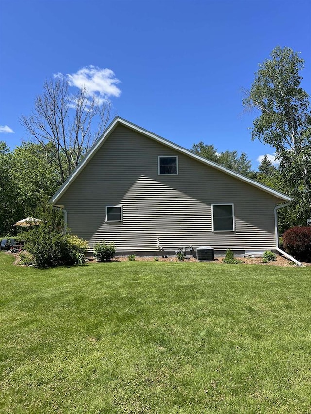 S9085 Meadowdale Rd, Prairie Du Sac, WI 53578 - view of side of home featuring a yard and cooling unit