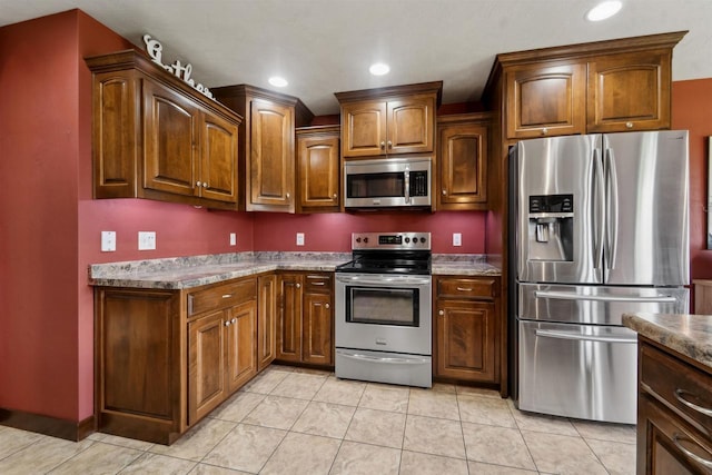 4201 Fieldcrest Dr, Kaukauna, WI 54130 - kitchen with appliances with stainless steel finishes, light tile patterned floors, and recessed lighting