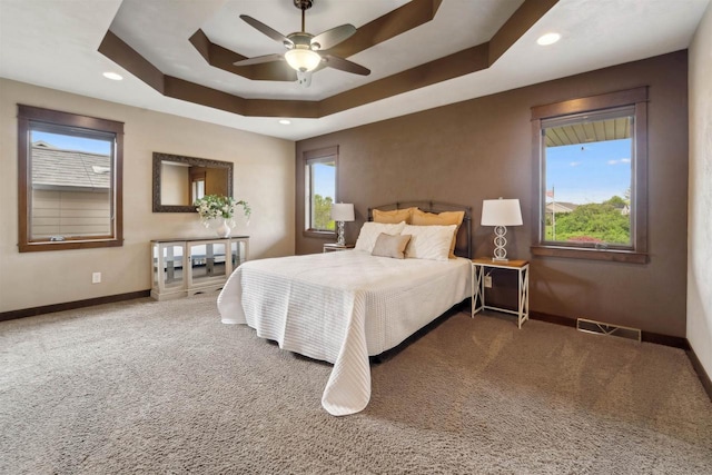 4201 Fieldcrest Dr, Kaukauna, WI 54130 - carpeted bedroom featuring baseboards, recessed lighting, a raised ceiling, and a ceiling fan