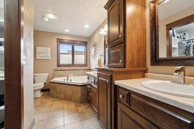 4201 Fieldcrest Dr, Kaukauna, WI 54130 - bathroom with tile patterned flooring, a bath, vanity, toilet, and recessed lighting