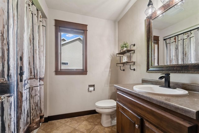 4201 Fieldcrest Dr, Kaukauna, WI 54130 - bathroom with vanity, toilet, tile patterned flooring, and baseboards