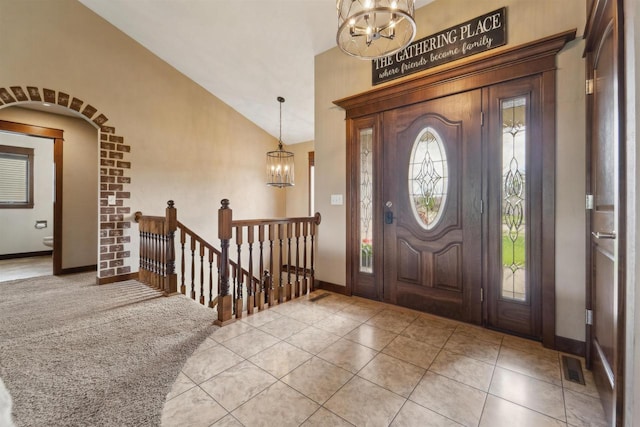 4201 Fieldcrest Dr, Kaukauna, WI 54130 - entryway with a chandelier, tile patterned floors, baseboards, and high vaulted ceiling