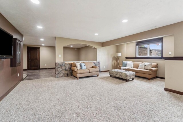 4201 Fieldcrest Dr, Kaukauna, WI 54130 - living room with carpet floors, baseboards, recessed lighting, and arched walkways