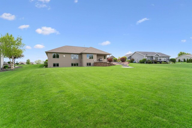 4201 Fieldcrest Dr, Kaukauna, WI 54130 - back of house with a yard and a residential view