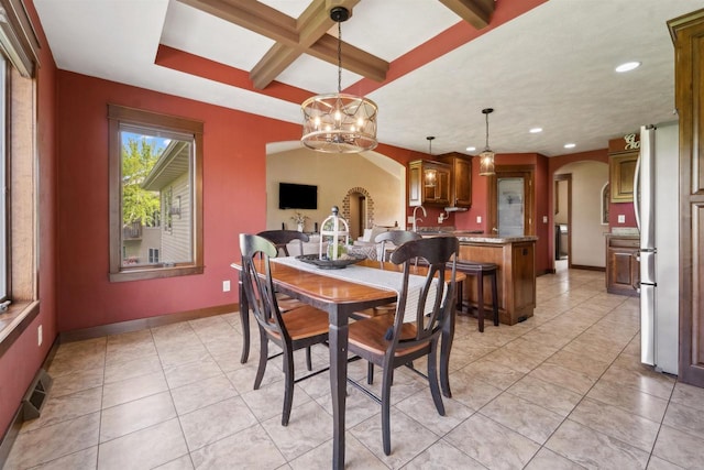 4201 Fieldcrest Dr, Kaukauna, WI 54130 - dining room featuring arched walkways, recessed lighting, a chandelier, baseboards, and light tile patterned floors