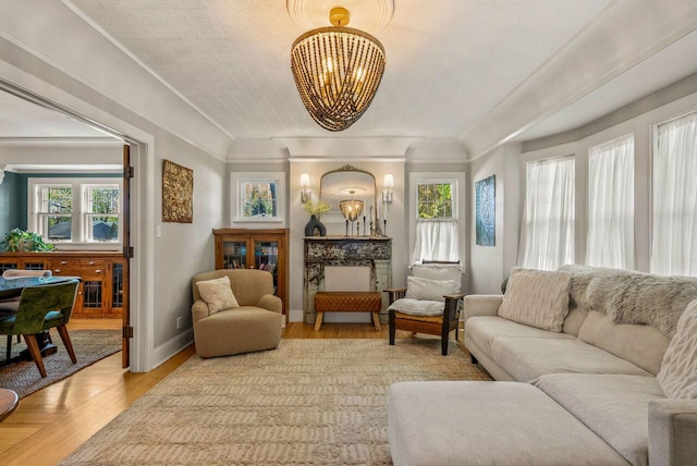 5642 N Argyle Ave, Glendale, WI 53209 - living room with a chandelier, light wood finished floors, healthy amount of natural light, and baseboards