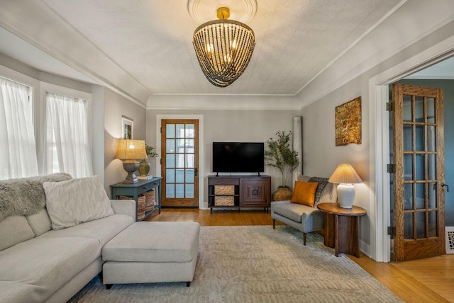 5642 N Argyle Ave, Glendale, WI 53209 - living area with a chandelier, wood finished floors, and ornamental molding