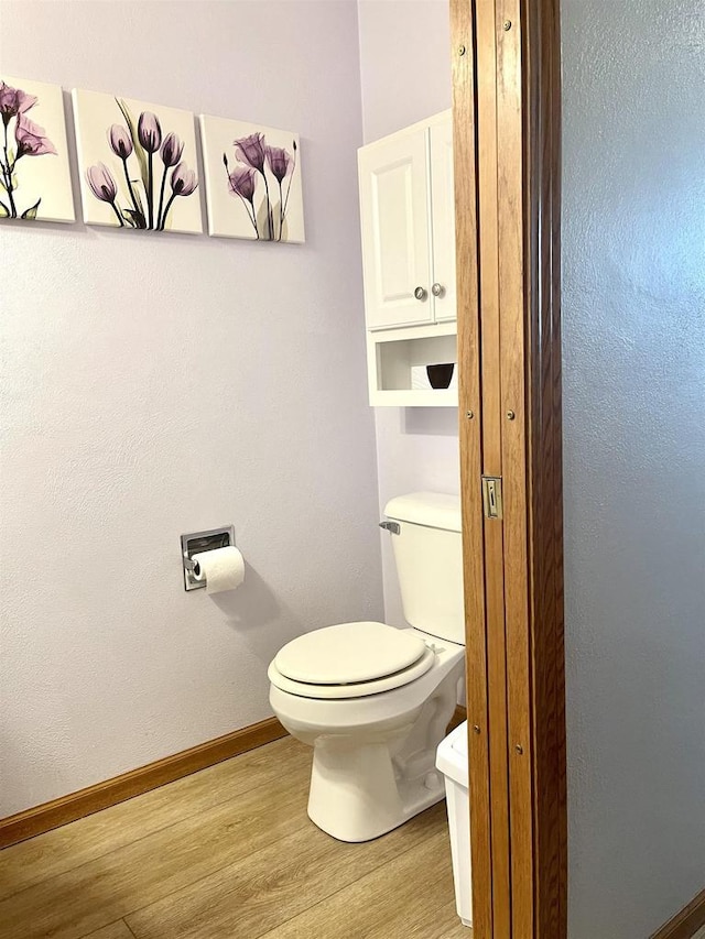 1401 E Bedford Ln, Appleton, WI 54915 - bathroom with wood finished floors, toilet, and baseboards