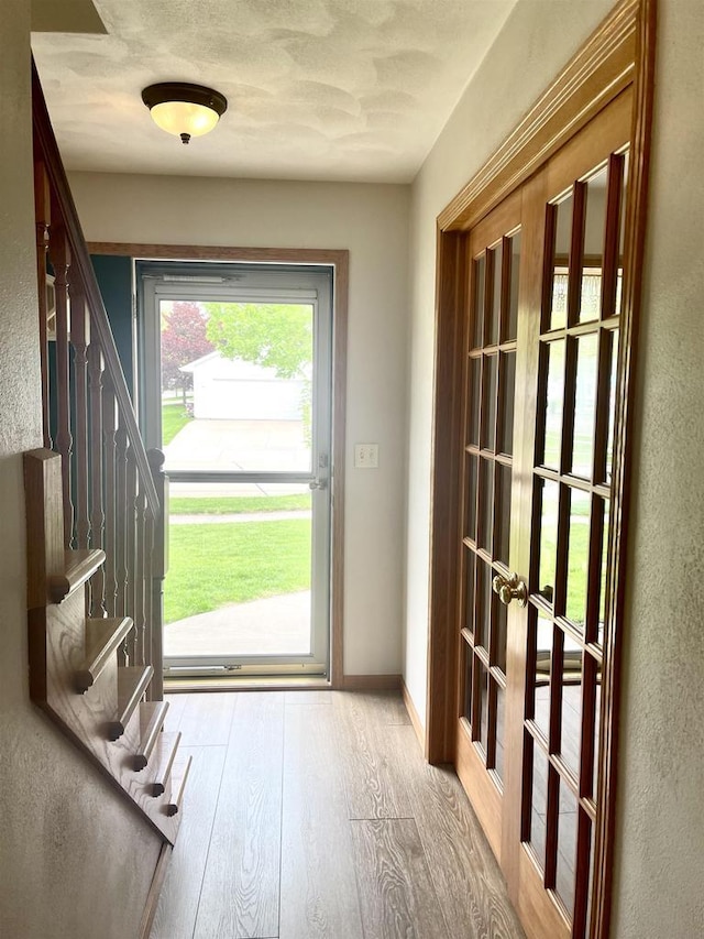 1401 E Bedford Ln, Appleton, WI 54915 - doorway to outside with stairway, wood finished floors, and baseboards