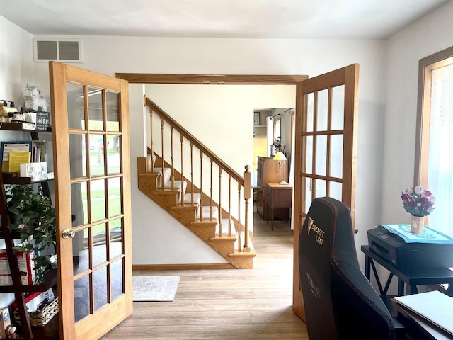 1401 E Bedford Ln, Appleton, WI 54915 - foyer with wood finished floors, stairs, french doors, and baseboards