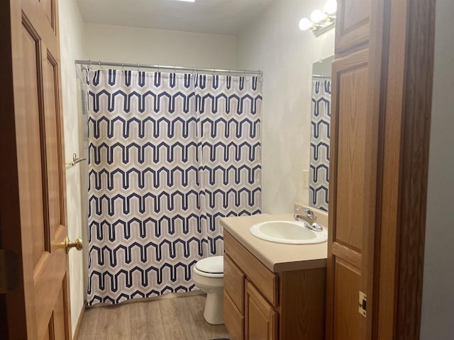 1401 E Bedford Ln, Appleton, WI 54915 - full bathroom with vanity, toilet, wood finished floors, and curtained shower