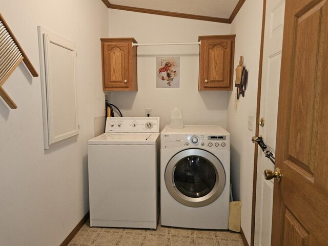 7098 Fire Tower Rd, Rhinelander, WI 54501 - laundry room with washer and clothes dryer, cabinet space, ornamental molding, and baseboards