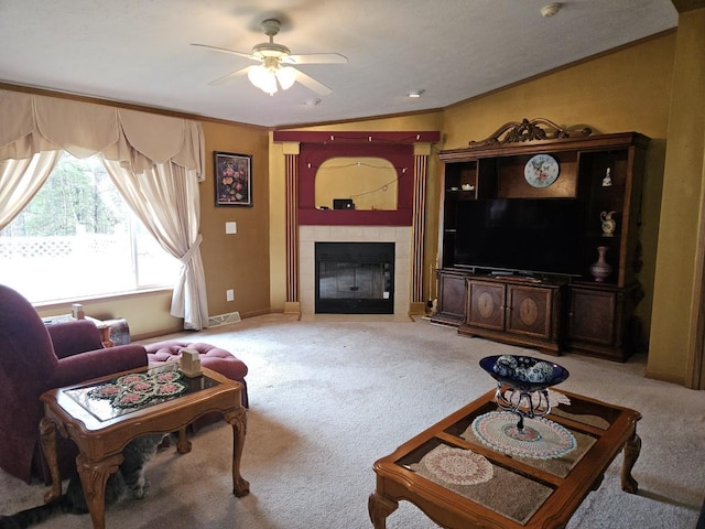 7098 Fire Tower Rd, Rhinelander, WI 54501 - living area with carpet floors, a fireplace, ceiling fan, ornamental molding, and baseboards