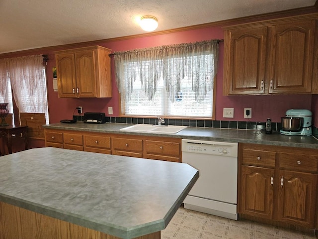 7098 Fire Tower Rd, Rhinelander, WI 54501 - kitchen featuring white dishwasher, a sink, brown cabinetry, a center island, and ornamental molding