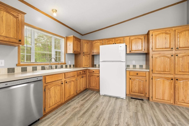 8401 4th Ave, Almond, WI 54909 - kitchen with freestanding refrigerator, dishwasher, a sink, vaulted ceiling, and crown molding