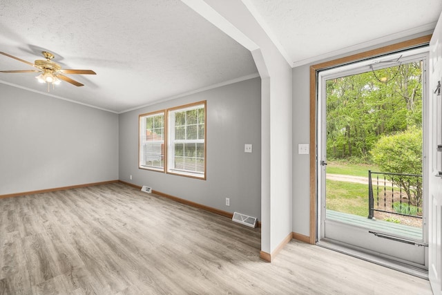 8401 4th Ave, Almond, WI 54909 - foyer entrance with ornamental molding, baseboards, a textured ceiling, wood finished floors, and a ceiling fan