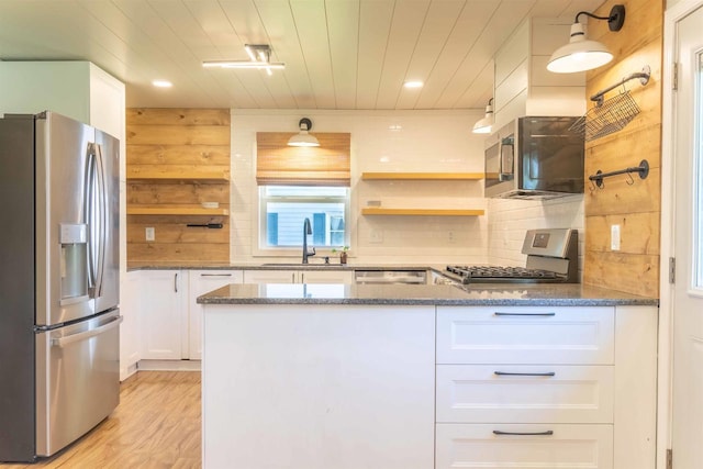 1230 Hiawatha Dr, Beaver Dam, WI 53916 - kitchen featuring appliances with stainless steel finishes, a sink, white cabinets, tasteful backsplash, and stone countertops