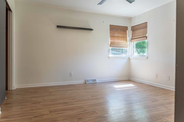1230 Hiawatha Dr, Beaver Dam, WI 53916 - unfurnished room featuring ceiling fan, wood finished floors, and baseboards