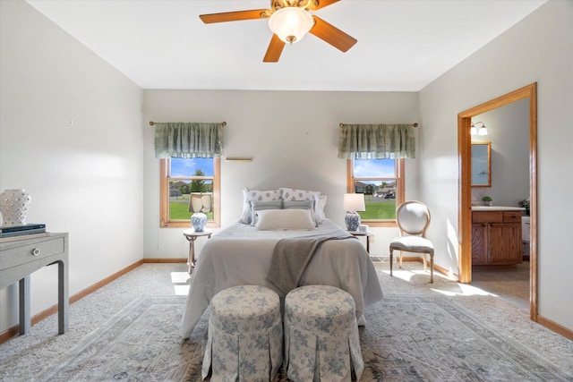 1758 Raintree Ln Unit 45, Mount Pleasant, WI 53406 - carpeted bedroom featuring baseboards, ensuite bathroom, and ceiling fan
