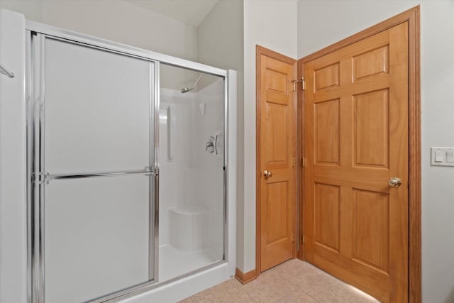 1758 Raintree Ln Unit 45, Mount Pleasant, WI 53406 - bathroom featuring a shower stall, tile patterned floors, and baseboards