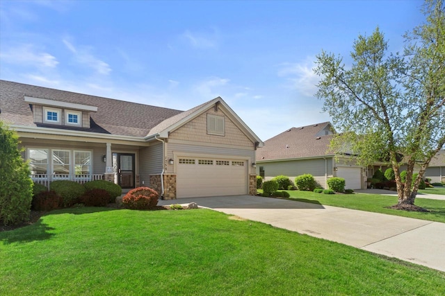 1758 Raintree Ln Unit 45, Mount Pleasant, WI 53406 - craftsman house with a front lawn, stone siding, driveway, and a garage