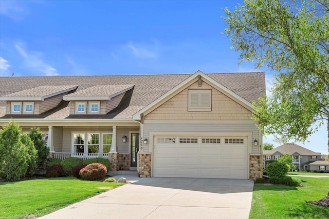 1758 Raintree Ln Unit 45, Mount Pleasant, WI 53406 - craftsman-style house with stone siding, concrete driveway, a front yard, and an attached garage