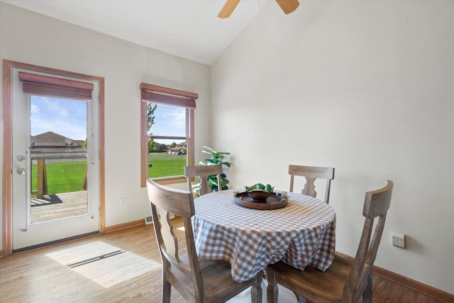 1758 Raintree Ln Unit 45, Mount Pleasant, WI 53406 - dining area featuring light wood-style flooring, baseboards, vaulted ceiling, and ceiling fan