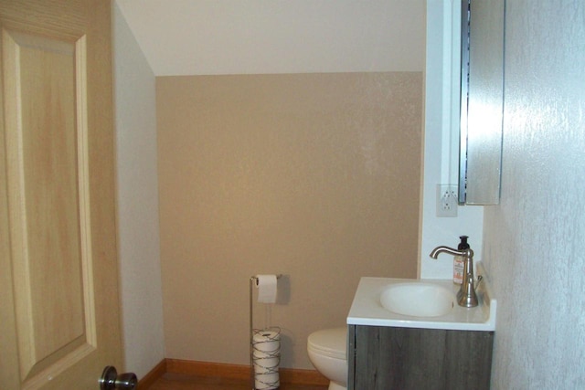 N5795 County Road A, Deerbrook, WI 54424 - half bath with toilet, vanity, and wood finished floors