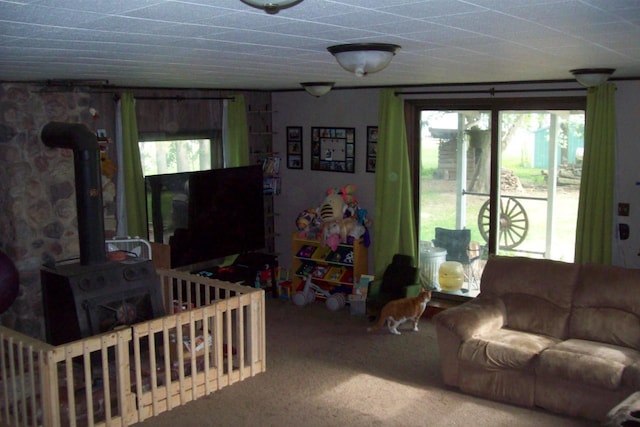 N5795 County Road A, Deerbrook, WI 54424 - carpeted living area featuring a wood stove