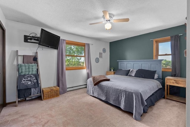 E7065 E County Road B, Colfax, WI 54730 - bedroom with a baseboard heating unit, carpet floors, a textured ceiling, and a ceiling fan