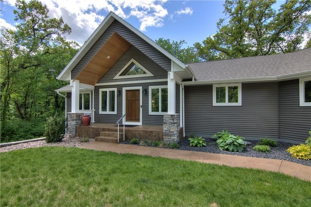4708 Abbey Rd, Eau Claire, WI 54701 - view of front of home with a front yard and stone siding