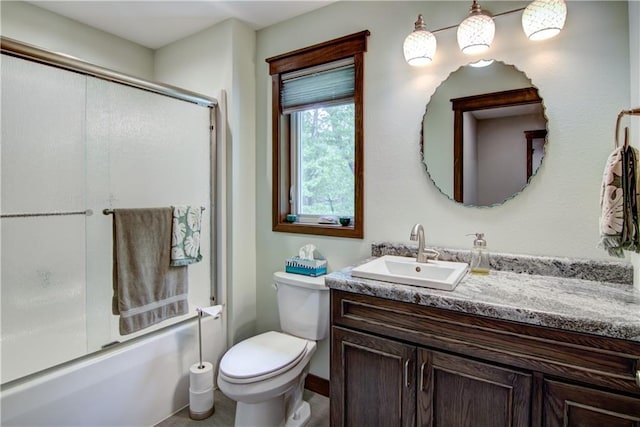 4708 Abbey Rd, Eau Claire, WI 54701 - bathroom with vanity, combined bath / shower with glass door, and toilet